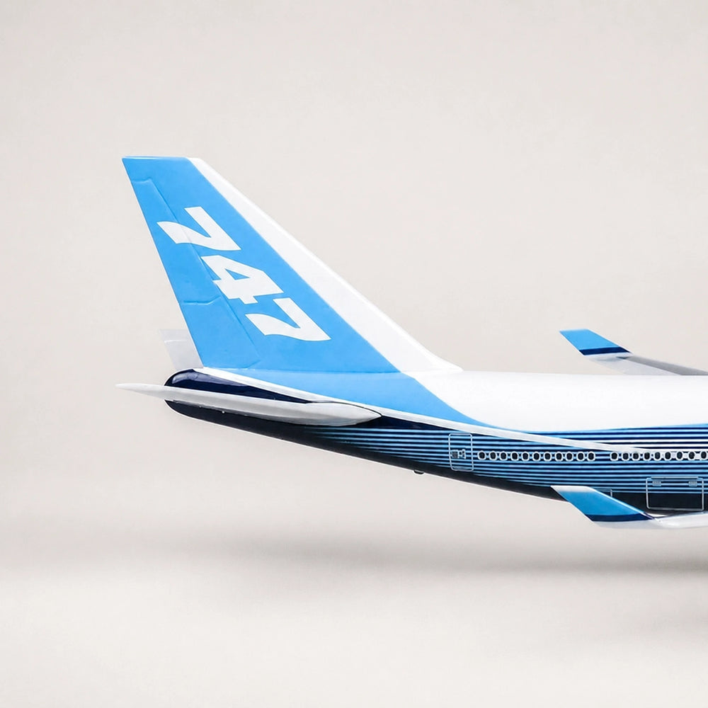 Boeing 747 cutaway aircraft model with open fuselage revealing detailed passenger cabin interior.