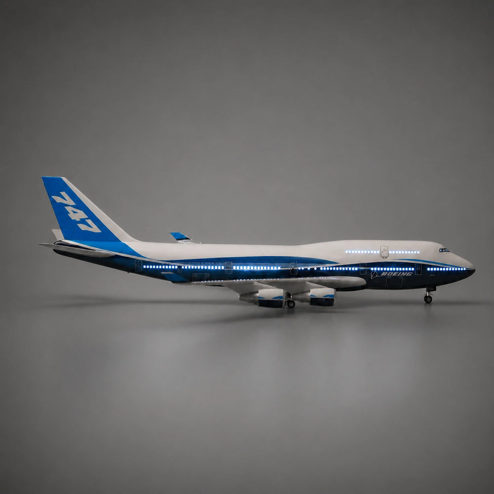 Boeing 747 aircraft model with illuminated LED cabin lights creating a realistic nighttime display.