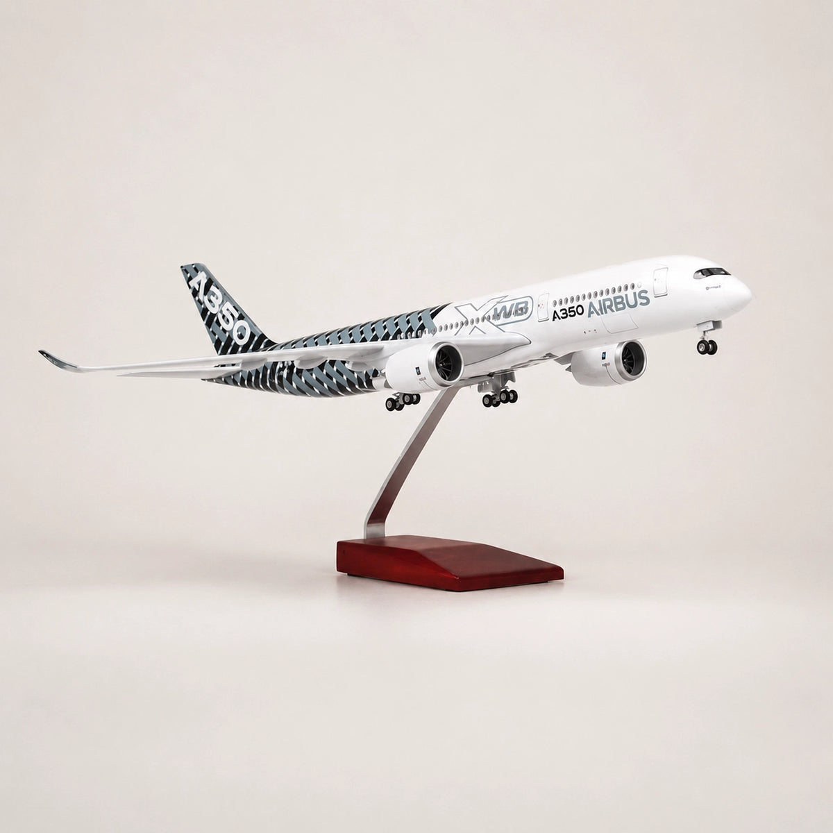 Prototype Airbus A350 XWB Carbon 1:142 scale LED airplane model displayed in flight mode on premium metal stand.
